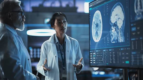 Industry Healthcare Doctors Looking At Scans